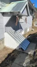 side door entrance to basement