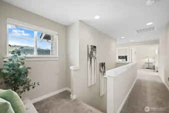 Top floor landing leading to double doors inviting you to the primary suite.