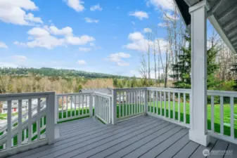 This cozy front porch is the perfect place to enjoy a morning cup of joy! (The deck is scheduled to be sanded and repainted prior to closing and with the weather allowing)