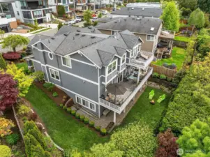 This photo gives you a great feel for both the scale of this home and its private setting.  The lot is large enough to create space between neighbors without being too much to maintain.  The back yard is the perfect amount of space to have a game of catch or to play with your dog.