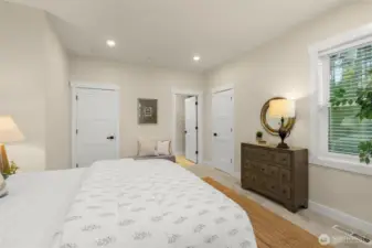 Primary bedroom offers dual closets, dual sinks, separate water closet, and walk-in shower.