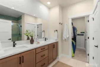 Double sinks w/ walk-in closet attached.