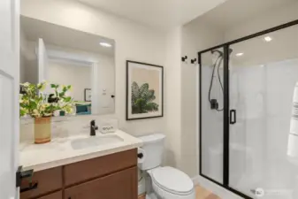 Ensuite 3/4 bath in lower-level bedroom.
