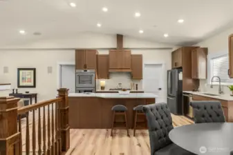 Vaulted ceiling with recessed lighting makes the space feel even larger.