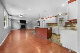 Open floorplan with kitchen island/bar, dining area, and great room feel!