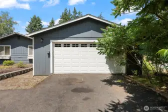 Detached garage is has matching door for a seamless addition.