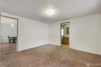 Primary BR with Bath & door to living room.