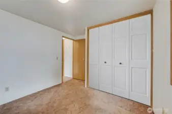 2nd BR with Virtually staged doors on closet.