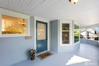 Freshly painted storybook wrap around front porch with the original doorbell you have to try! There's plenty of room to relax with a good book or your morning cup of coffee.