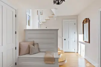 Welcoming front entry and bench with extra storage.