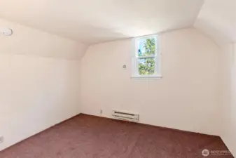 Small upstairs bedroom with a peek-a-boo view.
