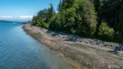 Close up view of the trail, property, and channel beyond.