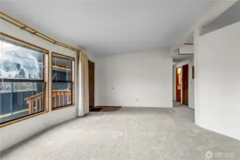 The wall at the right between the kitchen and dining room makes a great focal point for artwork or a TV.