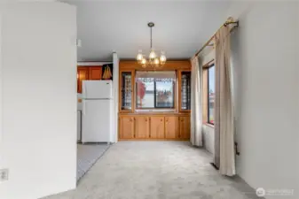 The good sized dining area includes a built in hutch with storage cabinets.