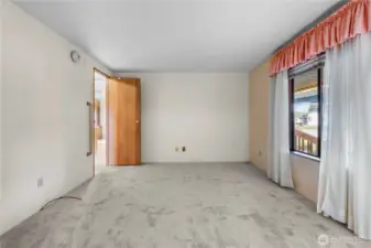 The spacious primary bedroom allows options for furniture layout.