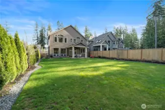 Large, professionally landscaped yard with wide side yard.