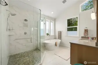 Large spa-like primary bathroom with upgraded finishes.