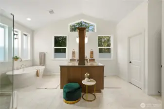 Expansive light filled bathroom featuring dual vanity sinks with large mirrors and quartz counters.