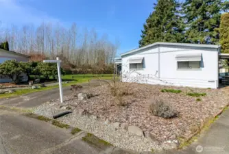 The lot next door is maintained by the community, ensuring a well-kept and aesthetically pleasing environment for all residents.