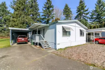 Carport installation including a new ramp for dwelling access.