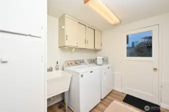Laundry area and access to the backyard.