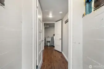 Basement entry for lower level, utility room straight ahead with utility sink, W & D, water heater and storage area for bicycles etc.