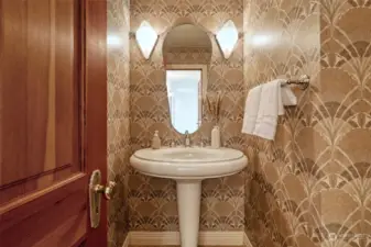 Upper Level Guest Powder Room with stunning pedestal sink & wall sconces flanking the vanity mirror; Designer wallpaper.