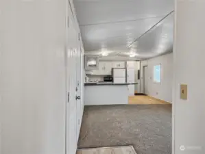 From the entry looking through the living room into the kitchen