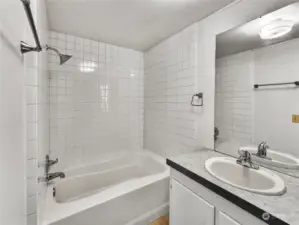 A light and bright primary bathroom designed for both comfort and convenience. This space features ample natural light, fresh updates, and a large storage closet perfect for keeping essentials organized