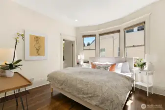 Main floor primary with hardwoods, adjoins to dressing room and full bath.