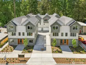 4 street side units are 2 bedroom, 2.5 bath, 1318 square with 2 car EV garages. 4 rear units are 4 bedroom, 2.5 bath, 1830 square feet with 2 car EV ready garages