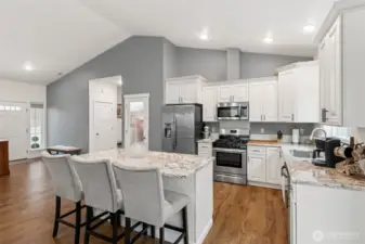 Kitchen features highly upgraded cabinetry and appliances