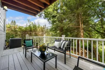 A lovely deck off the kitchen/dining area with partial views.
