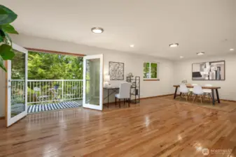 The upstairs features French doors with views to the back forest.