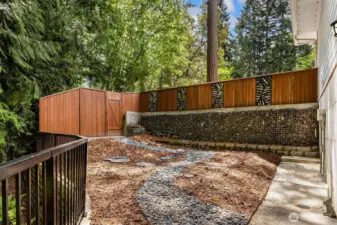 Fenced side yard with access from the basement or the front of the home.