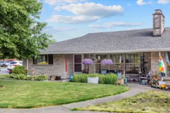 Covered front porch welcomes guests in style
