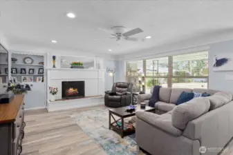 Wide picture windows with front yard views