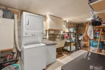 Spacious laundry and utility area with extra storage * Stacked washer & dryer for efficient use of space