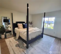 main bedroom with electric fireplace and 2 closets.