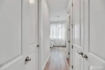 Left and right are closet spaces. Entry into primary bathroom