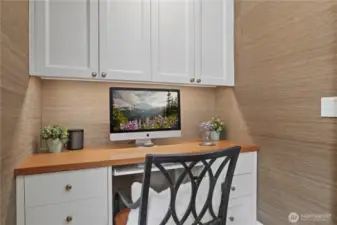 love the grass cloth touch with the perfect sized home office- cabinets to hide your clutter