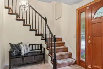 Come on in! Front entryway with bench nook and coat closet.