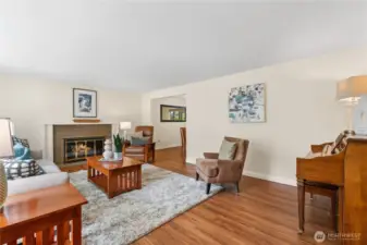 Looking to the left from the front door is the living room. Entertain guests, enjoy the light throught the bay windows, or keep cozy by the wood fireplace.