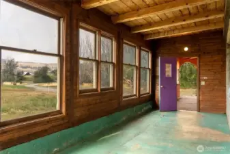 Sun room off of living room brings in light and provides an additional three season living space.  Easily heated to utilize year round.