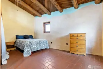 Tile floors and high ceilings in your primary bedroom.  All bedrooms are located on the main floor.