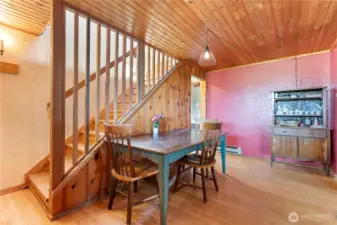 Stairs lead up to a study or bonus room.