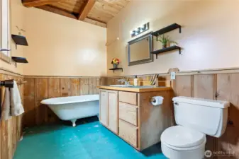 Second bathroom with claw foot soaking tub to service guests or the bedroom on this wing of the home.