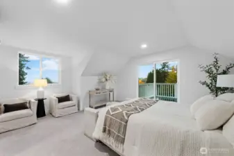 Upstairs bedroom with large deck with views of the Cascades