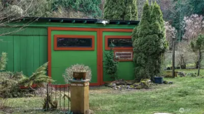 Detached shop/outbuilding offers versatile space for storage, hobbies, or workspace needs.