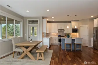Light and Bright dining area overseeing the beautifully landscaped yard.